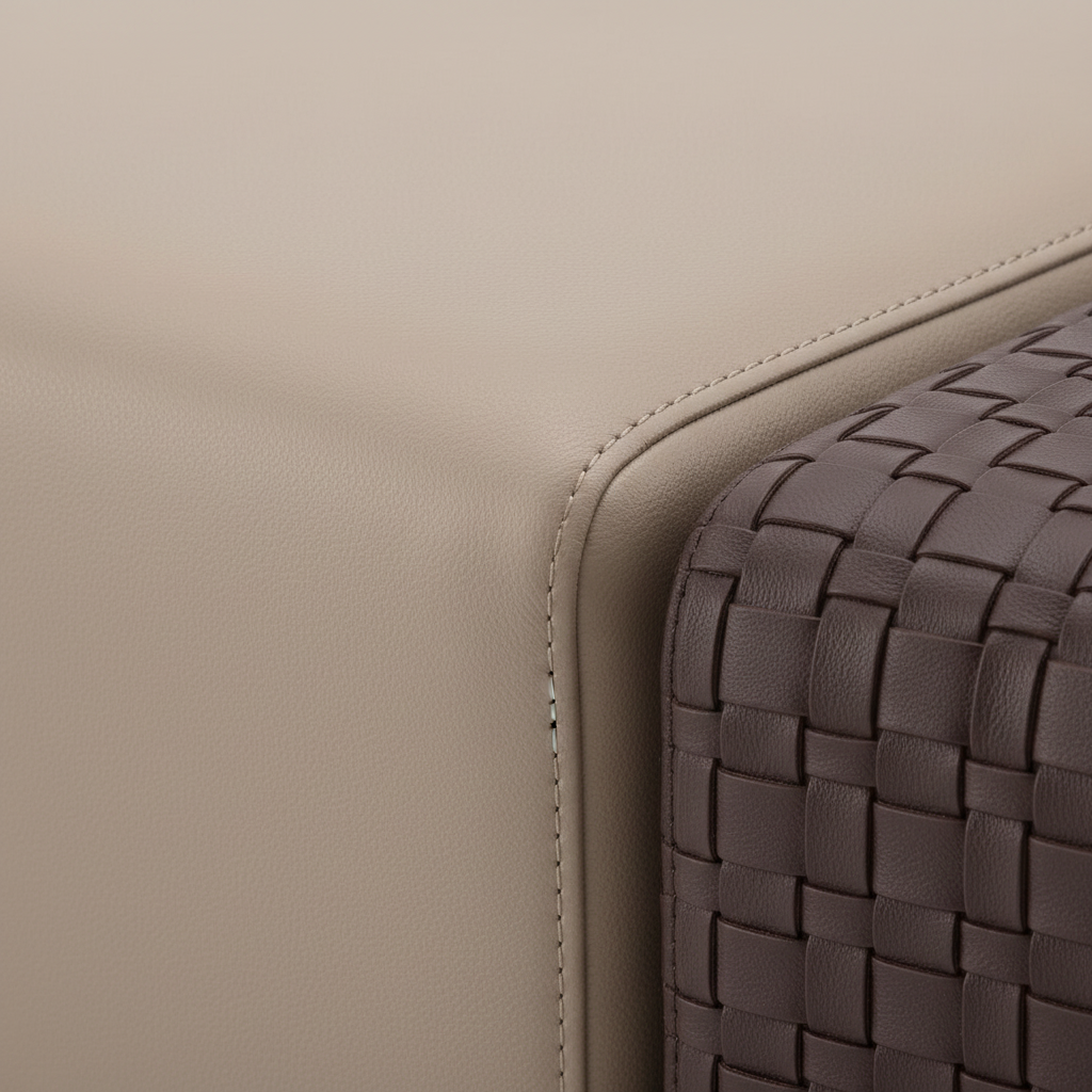 Close-up of the warm beige upholstery and rounded seam on the Drevane Stool