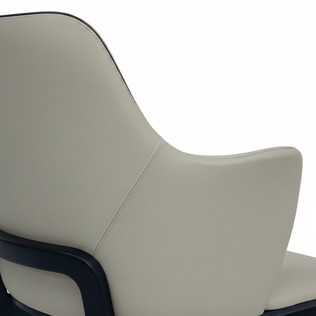 Julienne Dining Chair sculpted backrest, arm, seam, and dark piping detail on white background