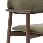 Wexorin Dining Chair armrest detail showing rounded walnut wood arm and gray upholstered back