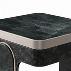 Close-up of the black marble tabletop and silver edge trim on the Maurelle End Table