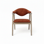 Thalia Dining Chair with rust orange upholstery and light wood, straight front view on white background