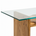 Close-up of Rensaro Dining Table glass tabletop edge and wood grain