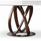 Close-up of Marcelline Dining Table intertwined dark wood loop base and oval metal floor plate