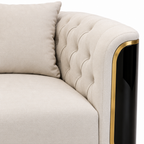 Palisandre Loveseat cream button tufting, black arm panel and gold trim close-up