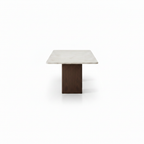 Lunavere Dining Table in marble and stainless steel, 90-degree side view on white background