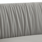 Close-up of the light gray fabric and pleated backrest channels on the Cordovan Sofa