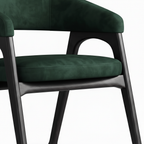 Delphine Dining Chair deep green seat cushion and dark wood leg detail on white background