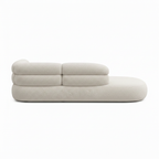 Side profile of the Wynmere fabric sectional sofa showing armrest, seat height and backrest silhouette on a white background.
