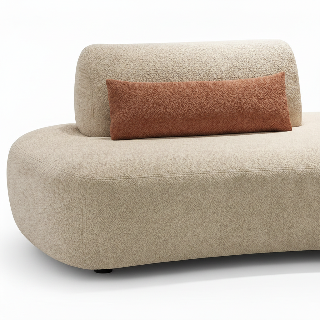 Close-up of the Lacour sectional light neutral upholstery texture, rounded seat edge, seam, and brown accent cushion.
