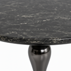 Close-up of the natural dark stone tabletop and edge on the Jervain End Table