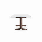 Lenora Marble Dining Table in a 90-degree end-on view with four L-shaped legs
