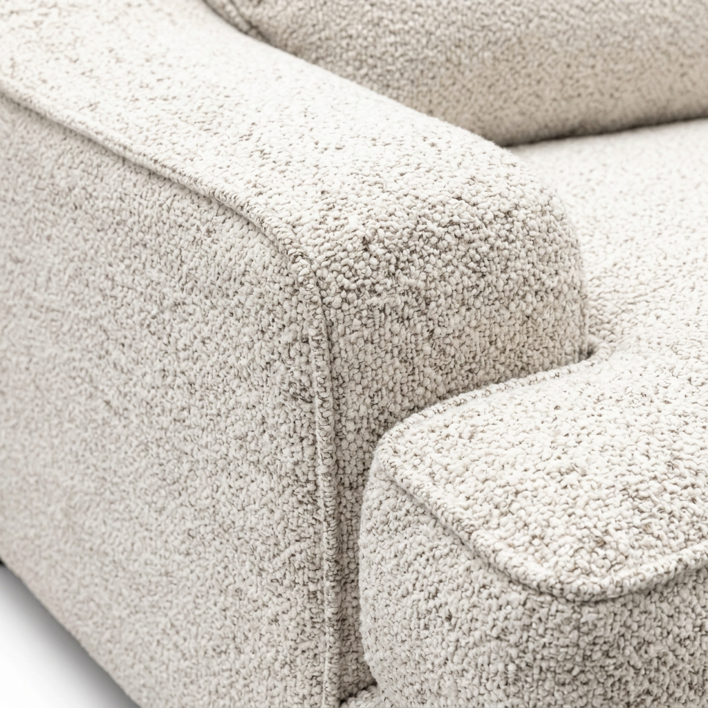 Vellora River Rock Sofa sloped arm and seat cushion detail showing ivory textured upholstery