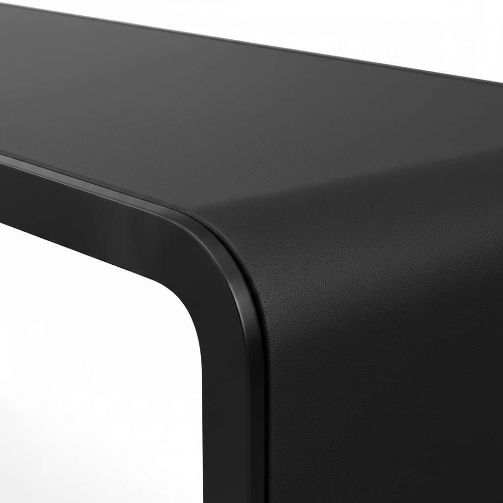 Close-up of the long black leather tabletop and rounded edge on the Larsen Noir End Table