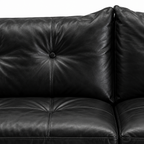Liorenzo Sofa black leather tufted back cushion and button close-up