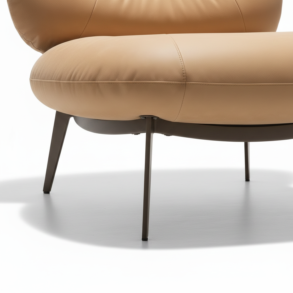 Kavessa Leather Accent Chair metal leg detail showing the sturdy support structure beneath the leather seat.