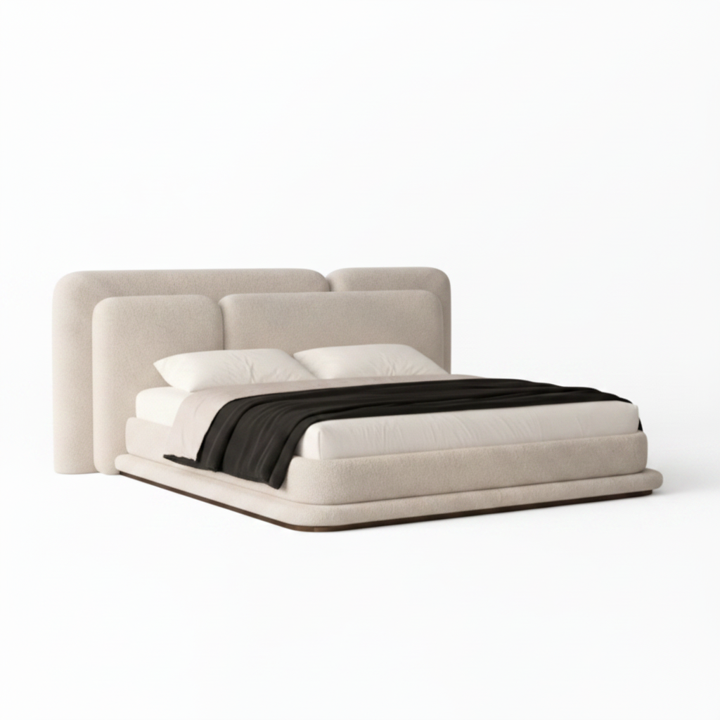 Kendric Bed left-side view with cream fabric headboard, white bedding, and black throw