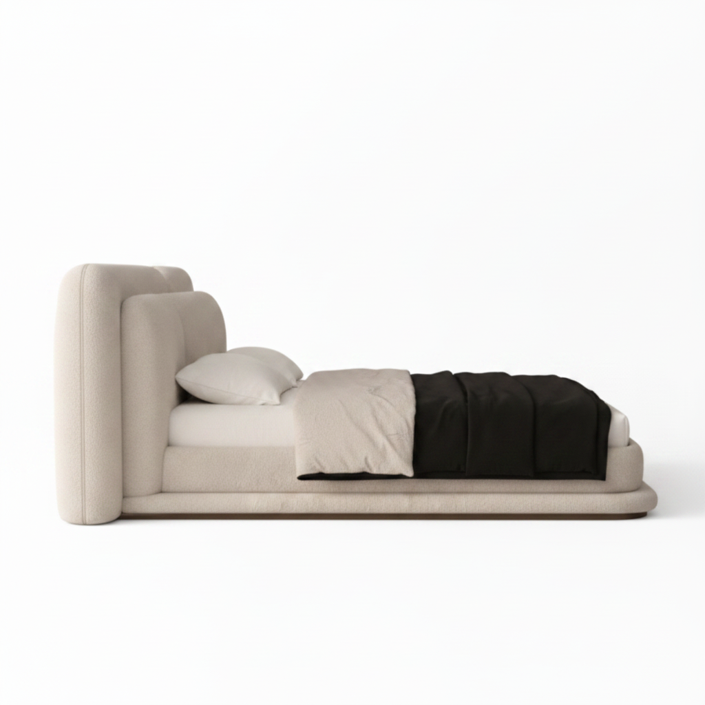 Kendric Bed right-side view with cream fabric headboard, white bedding, and black throw