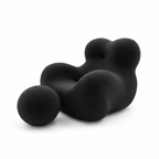 Mamma's Embrace Accent Chair — black upholstery and spherical footstool, three-quarter view facing left