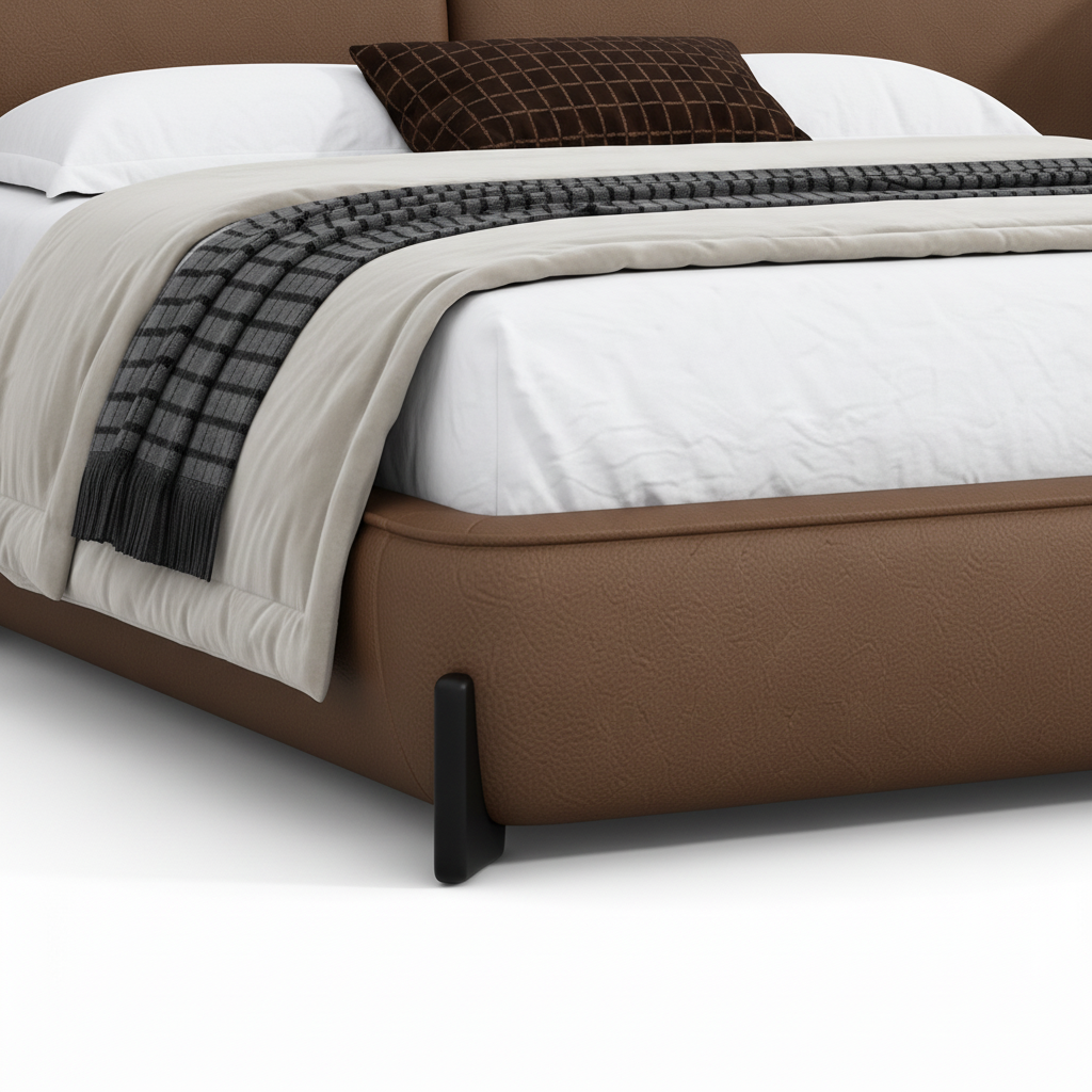 Mavero Leather Bed close-up of leather footboard and support foot detail on a white background