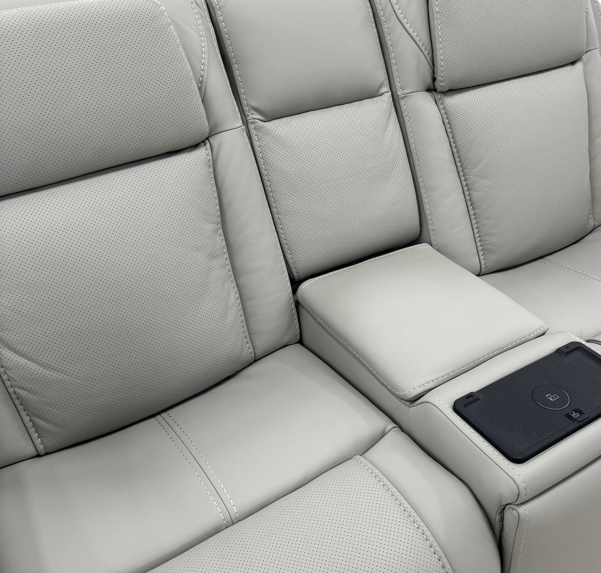Montreval Console Loveseat in grey upholstery, backrest, seat and fixed console detail, white background