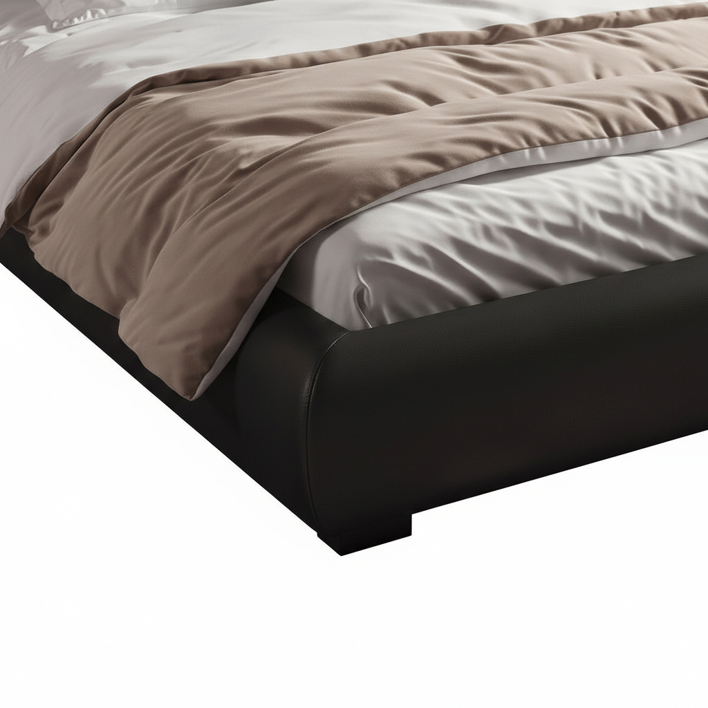 Oberon Bed close-up of black upholstered base, bedding edge, beige throw, stitching, and lower foot