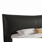 Oberon Bed right-side view with black upholstered frame, white bedding, beige throw, and curved headboard