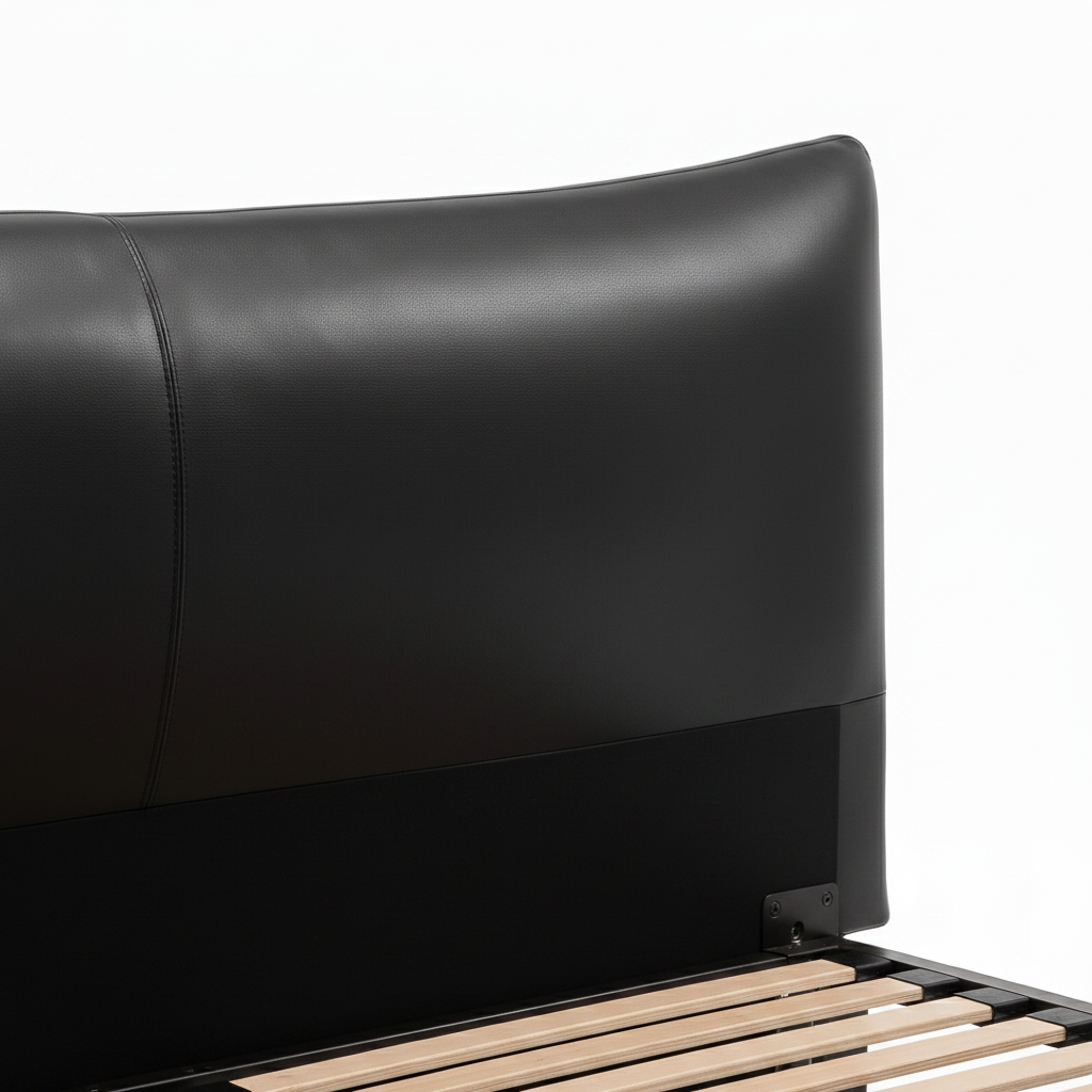 Perrenza Wood Bed close-up of black headboard detail on a white background