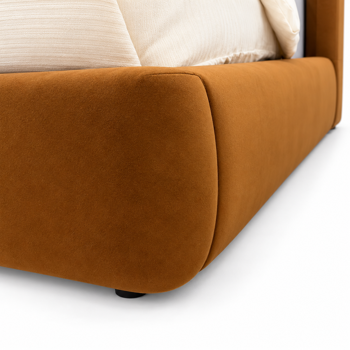 Trevers bed — rounded upholstered footboard and side rail detail