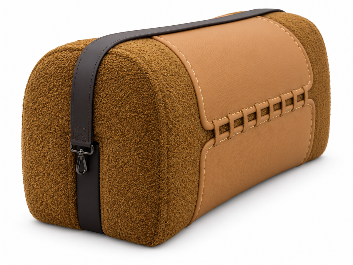 Valetto Saddle Ottoman textured fabric end and dark strap detail