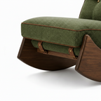 Xylaro Accent Chair close-up of curved wood base and leather strap buckle detail on a white backgroun